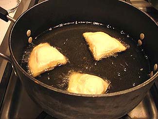 Frying samosas